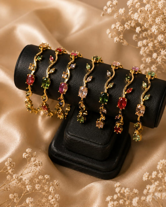 Gold-plated tulip bracelet with colorful gemstone floral vine design