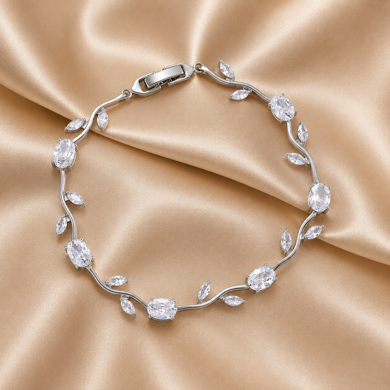 A silver vine bracelet with clear marquise and oval gemstones, 